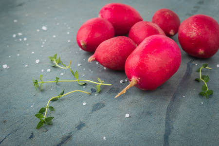Fresh radishes on vintage background. Healthy vegetable.の写真素材
