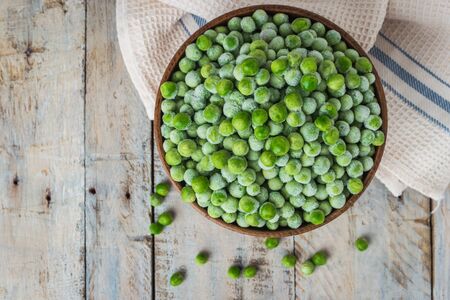 Fresh frozen peas. Vegetable food background healthy vegetarian natural meal.の写真素材