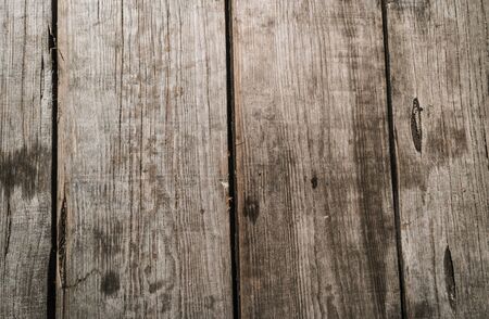 Rustic weathered barn wood background with knots and nail holesの写真素材