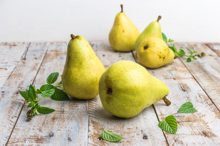Fresh organic pears on old wood. Fruit background. Pear autumn harvest.の写真素材