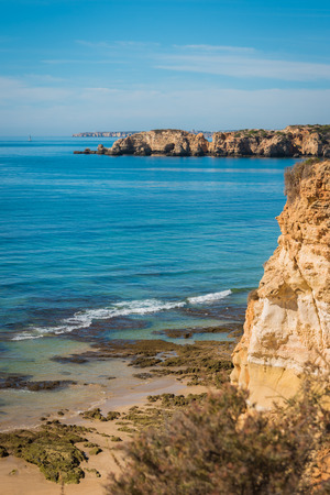 Scenic golden cliffs near Alvor, Portimao. This beach is a part of famous tourist region Algarveの写真素材