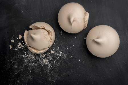 French meringue cookies on slate background. Top view with copy spaceの写真素材