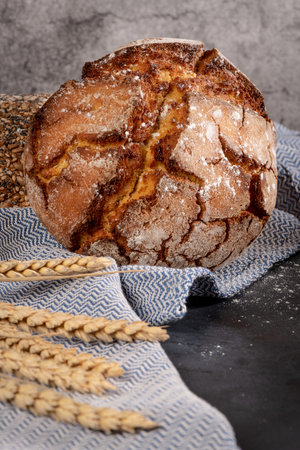 Fresh fragrant bread on the table. Food concept. Bakery, crusty loaves of bread and buns. Assortment...