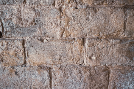 Stone wall of old limestone stones. Abstract texture backgroundの写真素材
