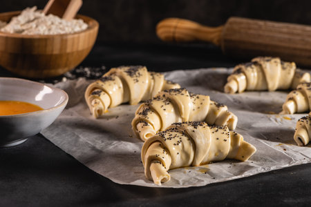 The dough for croissants. Preparation of croissants in the kitchen with ingredientsの写真素材