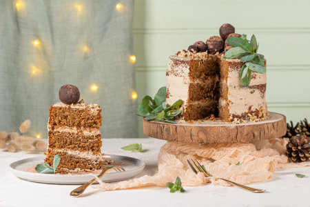 Slice of delicious naked chocolate and hazelnuts cake on table rustic wood kitchen countertop.
