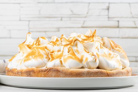 Lemon tart pie with meringue cream. Traditional American cake. Homemade baking. Copy space.の写真素材