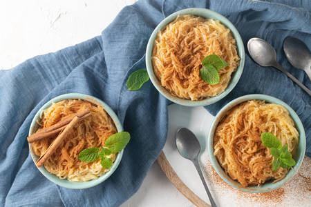 Aletria is a classic Portuguese vermicelli pudding and this is a traditionally served at Christmas time. This is one of the favourites pudding from Portugal. Top view. Flat layの写真素材