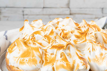 Lemon tart pie with meringue cream. Traditional American cake. Homemade baking. Copy spaceの写真素材