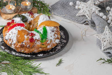Bolo Rei or King's Cake is a traditional Xmas cake with fruits raisins nut and icing  on kitcthen countertop. Is made for Christmas, Carnavale or Mardi Grasの写真素材