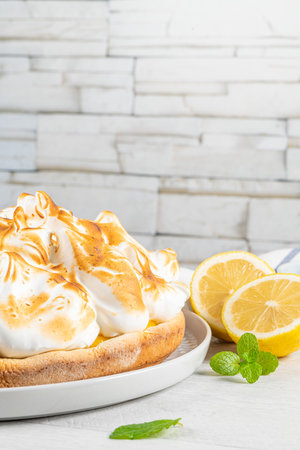 Lemon tart pie with meringue cream. Traditional American cake. Homemade baking. Copy spaceの写真素材