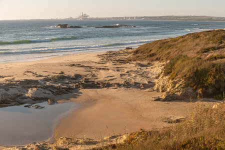 Landscape of Sao Torpes beach Portugal at sunset.の写真素材