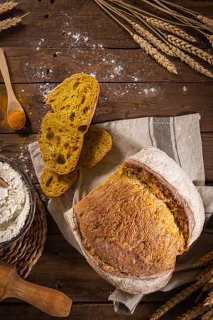 Freshly artisan baked wheat, turmeric and rye bread, country bread. Simple bread for breakfastの写真素材