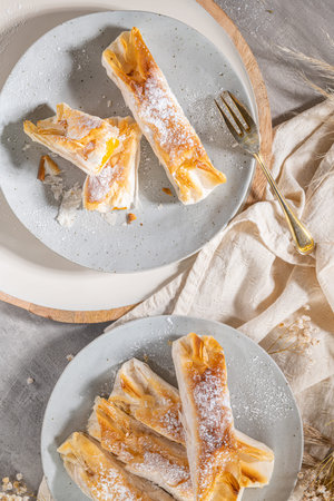 Typical portuguese sweets Pasteis de Vouzela served on countertop. Filo pastry with egg cream...