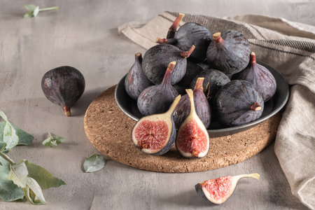 Delicious figs in a plate. Kitchen countertop with some ready-to-eat figs. Space for text