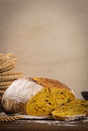 Freshly artisan baked wheat, turmeric and rye bread, country bread. Simple bread for breakfastの写真素材