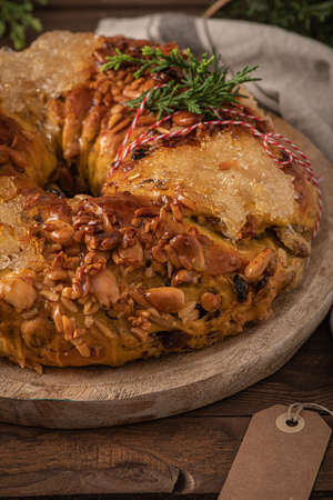 Bolo rainha or queen's cake is a traditional portuguese Xmas cake with fruits raisins nut on kitchen countertop. Served with orange tea. Is made for Christmas, Carnavale or Mardi Grasの写真素材
