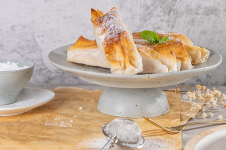 Typical portuguese sweets Pasteis de Vouzela served on countertop. Filo pastry with egg cream...