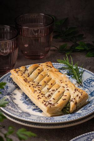 Homemade savory braided puff pastry with spinach and ricotta filling.の写真素材