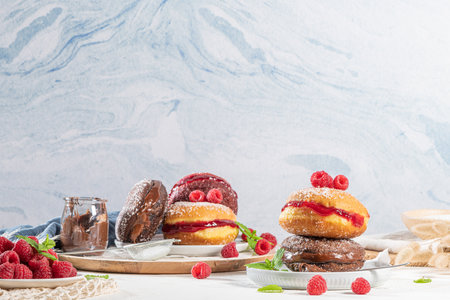 Berlin Balls, or Berlin Balls. Portuguese fried dough with sugar, filled with chocolate or raspberry jam. Portuguese fried dough with sugar.の写真素材