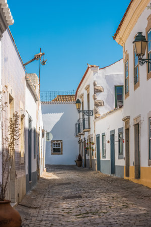 Small street in the old town of Faro in Algarve region, south of Portugal.の写真素材