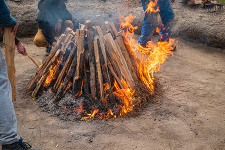 AMARANTE, PORTUGAL - CIRCA APRIL 2022: Preparation of the bonfire during the cooking process of the black clay of Gondar in Amarante, Portugal.のeditorial素材