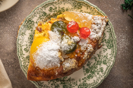 Bolo Rei or Kings Cake is a traditional Xmas cake with fruits raisins nut and icing on kitcthen countertop. Is made for Christmas, Carnavale or Mardi Grasの写真素材