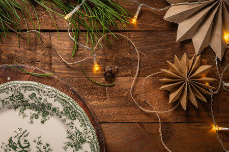 Christmas background with pine branches tree and decoration on dark wooden board. Flat lay. Space for textの写真素材