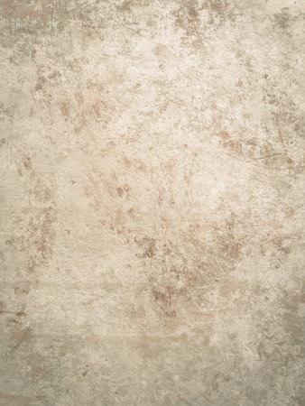 Detailed close-up of a beige glazed porcelain tile featuring a realistic aged stone or concrete texture with subtle variations and marks, perfect for backgroundsの写真素材