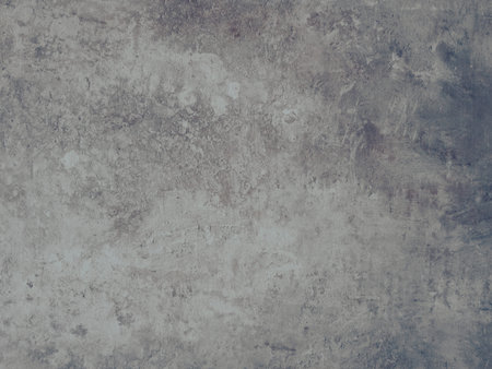 Grey textured Dekton surface resembling aged concrete or stone, ideal for backgrounds, modern...