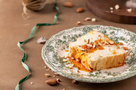 A slightly elevated shot captures a slice of traditional caramelized egg white pudding known as...