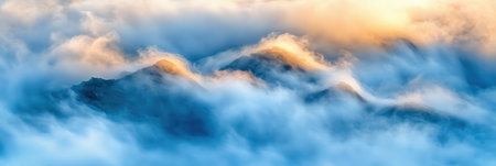 Majestic Mountains Enveloped in Soft Blue Clouds Golden Sunrise sky fog art view peak mist calmの素材