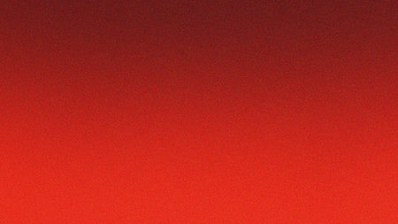 A vibrant and energetic red gradient background featuring a subtle grainy noise texture. The smooth transition from bright red to a deeper, darker red creates a dynamic visual appeal. Perfect for modern digital designs, website banners, social media posts, presentations, wallpapers, and any project requiring a bold, textured abstract backdrop.の素材