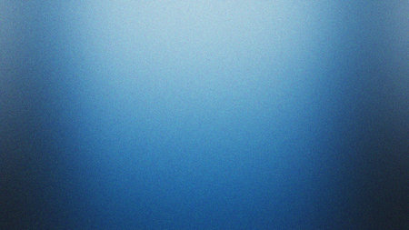 A vibrant blue gradient background featuring a subtle noise texture, creating a modern and versatile visual. The color transitions smoothly from light blue to a deeper indigo, offering a calm and appealing aesthetic. Ideal for web design, digital presentations, social media graphics, product showcases, or contemporary wallpaper.の素材