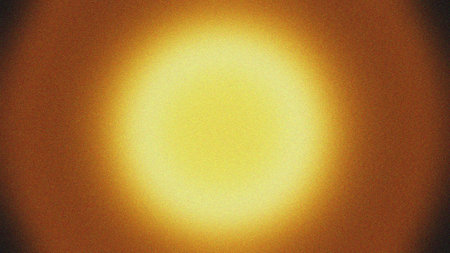 A vibrant golden radial gradient background with a grain texture effect, creating a warm and inviting atmosphere, ideal for use as a backdrop for presentations, websites, or branding materials, conveying a sense of luxury and sophistication.の素材