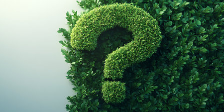 A green question mark formed from foliage against a white background.の素材
