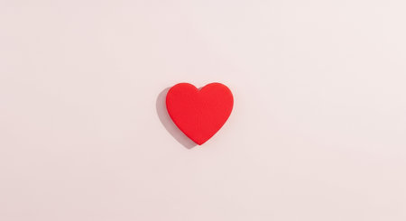Red paper heart on white background, valentine's day conceptの素材