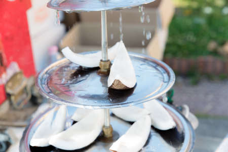 coconut street snacks with dripping water falling overの写真素材