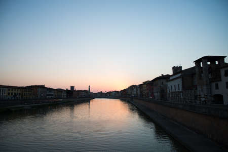 Pisa, Italy, Arno river view at the sunsetの写真素材