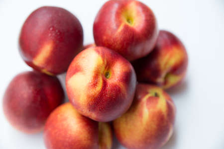 Ripe peaches on a white backgroundの写真素材