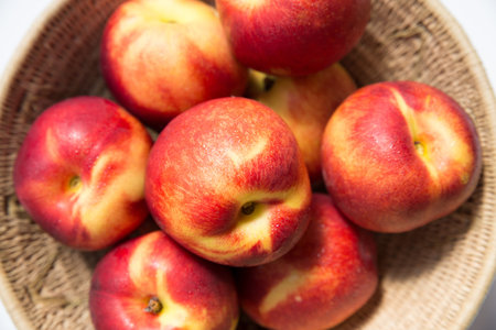 Ripe peaches on basketball