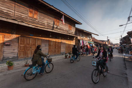 Chaing Khan,Loei, Thailand. - February,02,2014: Unidentified old house and people on a walking Street  in Chaing Khan,Loei, Thailand. Walking Street is a popular attraction. Almost 20 million tourists visited Thailand .のeditorial素材