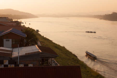 Chaing Khan, Loei, Thailand. - February,01,2014: Cruise boat trip take tourists to the Mekong River to watch the sunset at Chaing Khan, Loei, Thailand.のeditorial素材