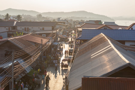 Chaing Khan,Loei, Thailand. - February,01,2014: Unidentified old house and people on a walking Street  in Chaing Khan,Loei, Thailand. Walking Street is a popular attraction. Almost 20 million tourists visited Thailand .のeditorial素材