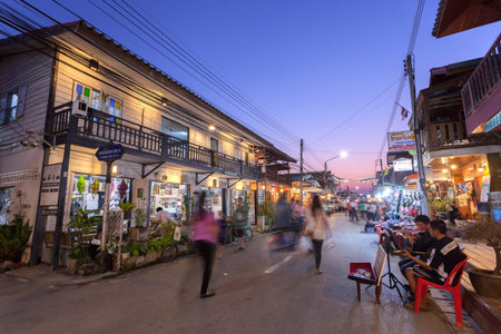 Chaing Khan,Loei, Thailand. - February,01,2014: Unidentified old house and people on a walking Street  in Chaing Khan,Loei, Thailand. Walking Street is a popular attraction. Almost 20 million tourists visited Thailand .のeditorial素材