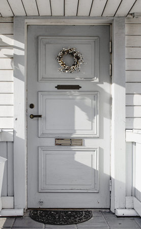 Entrance door. The porch of the house. Frontal side of the house.