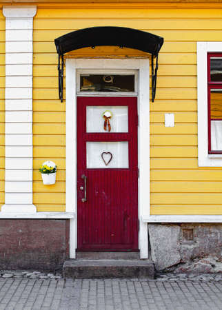 Entrance door. The porch of the house. Frontal side of the house.の写真素材