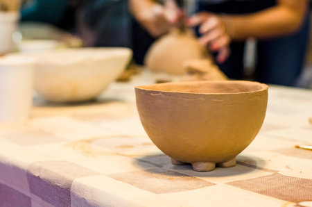 Plate made of clay. Hand made. Creating dishes with your own hands. Manual creativity. Development of fine motor skills. Art. Hobby.の写真素材