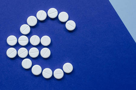 The concept of health. Spending money to buy pills. Money for treatment. Payment Euro.の写真素材