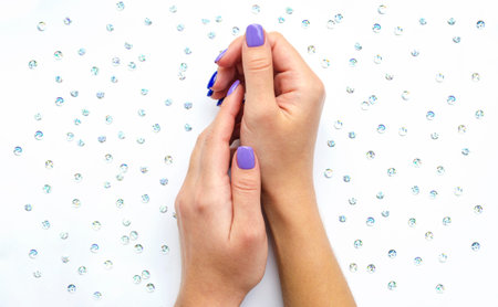 Stylish trendy women's manicure. Blue and lilac color gel Polish. The view from the top. Care....